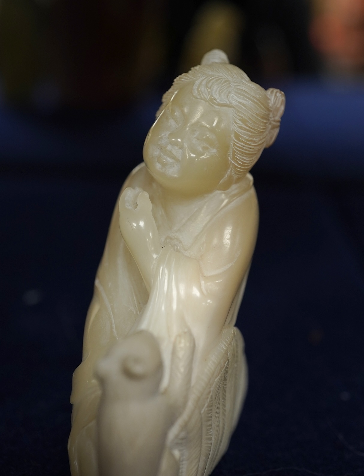 A Chinese white jade 'boys with jar' carving and three shoushan stone figures; luohan, girl with squirrel and mermaid (4), tallest 11cm